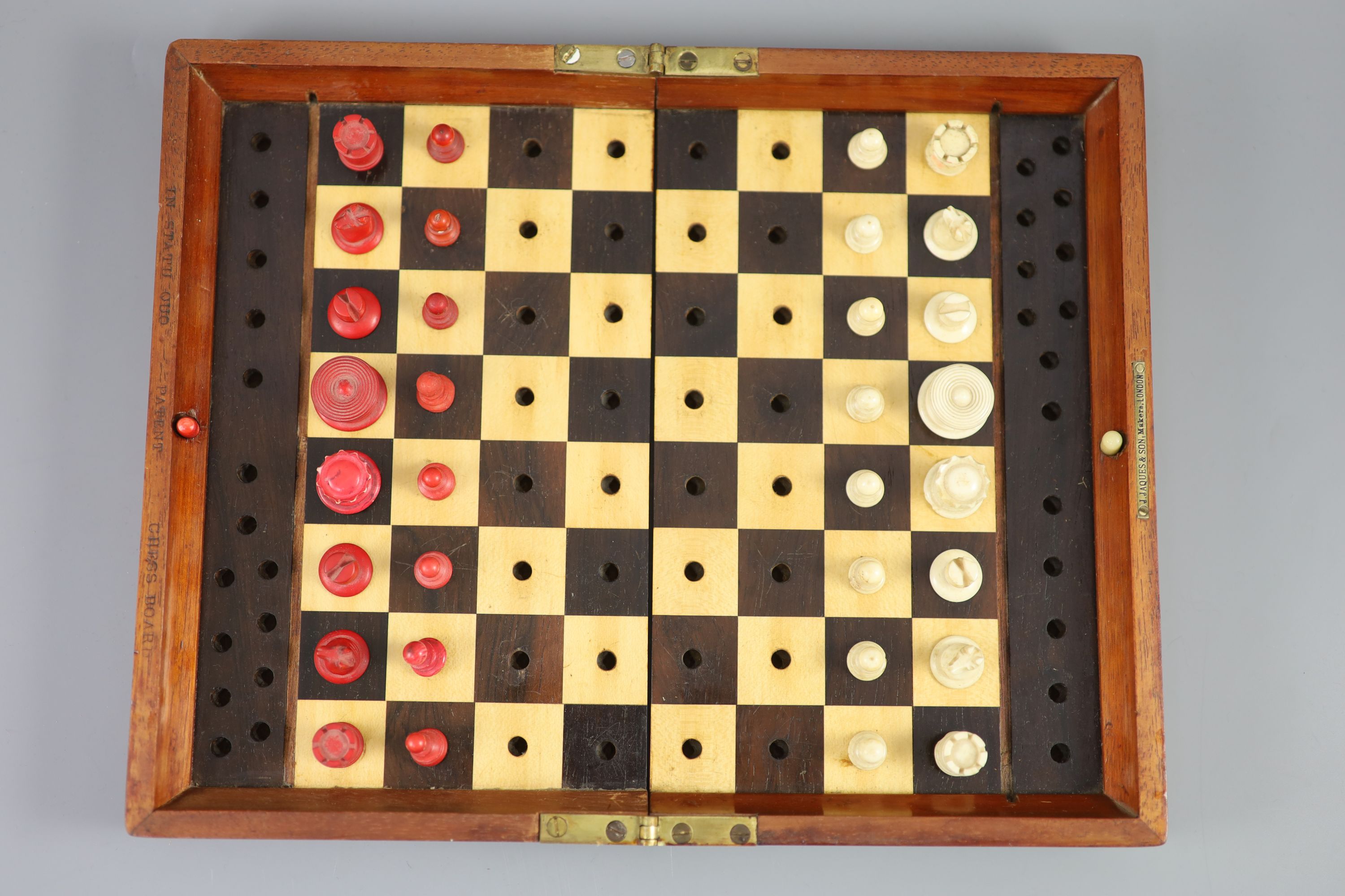 A Jaques & Son Ltd In Statu Quo bone travelling chess set, in mahogany case, c.1860, 9 x 5.5in.